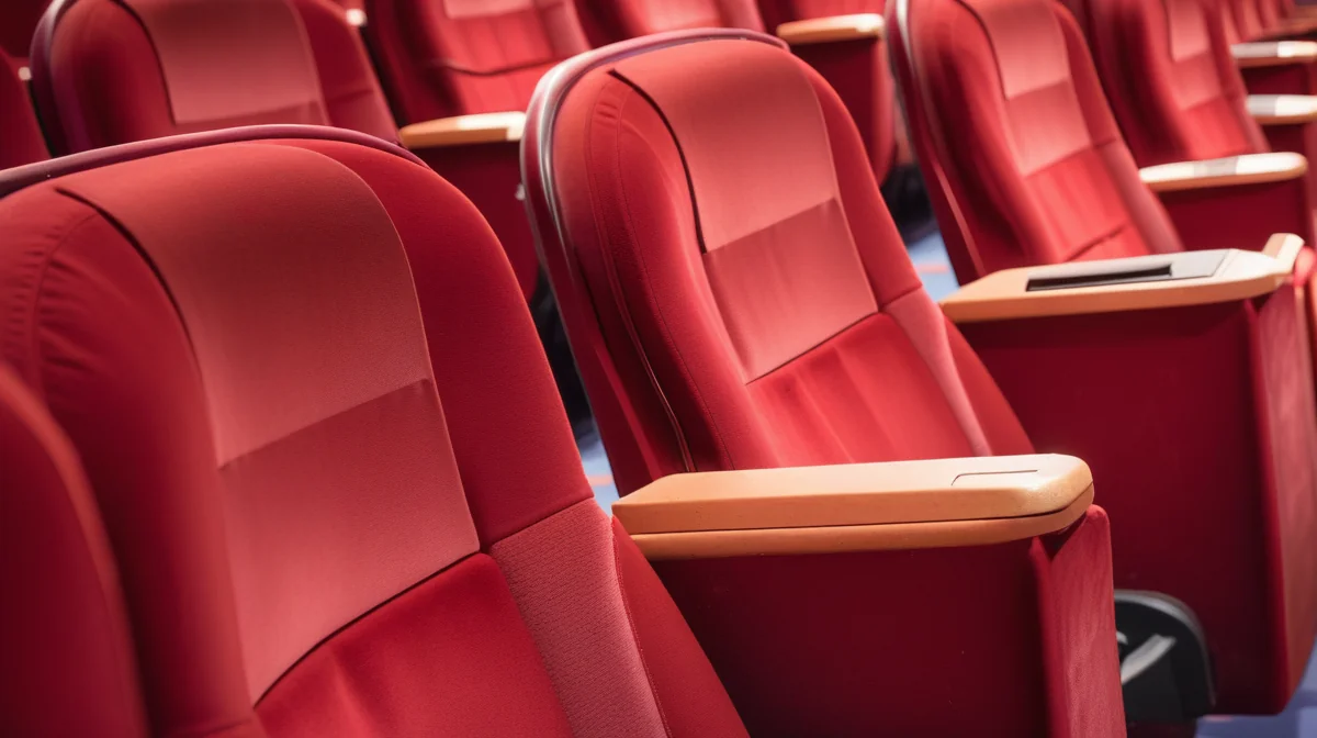 Half-empty multiplex hall showing the occupancy gap behind reported box office numbers